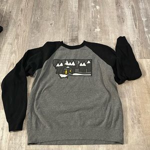 Black and grey crewneck sweatshirt.